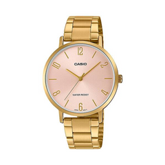 Gold Casio watch with a pinkish-beige dial on a white background