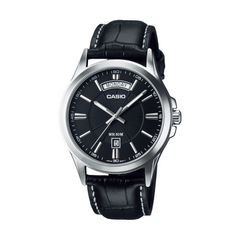 Casio watch with black leather strap and black dial on a white background