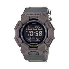 Casio G-Shock digital watch with a gray case and band on a white background
