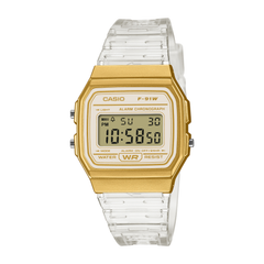 Gold Casio digital watch with clear strap on a white background