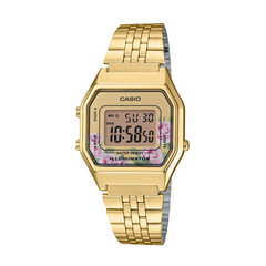 Gold Casio digital watch with floral display on a white background