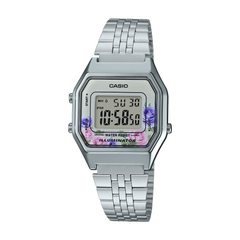 Casio digital watch with floral display on a white background