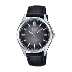 Casio watch with black leather strap and dark face on a white background