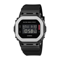 Black Casio digital watch with silver face on a white background