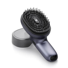 Pet grooming brush with black bristles on a white background
