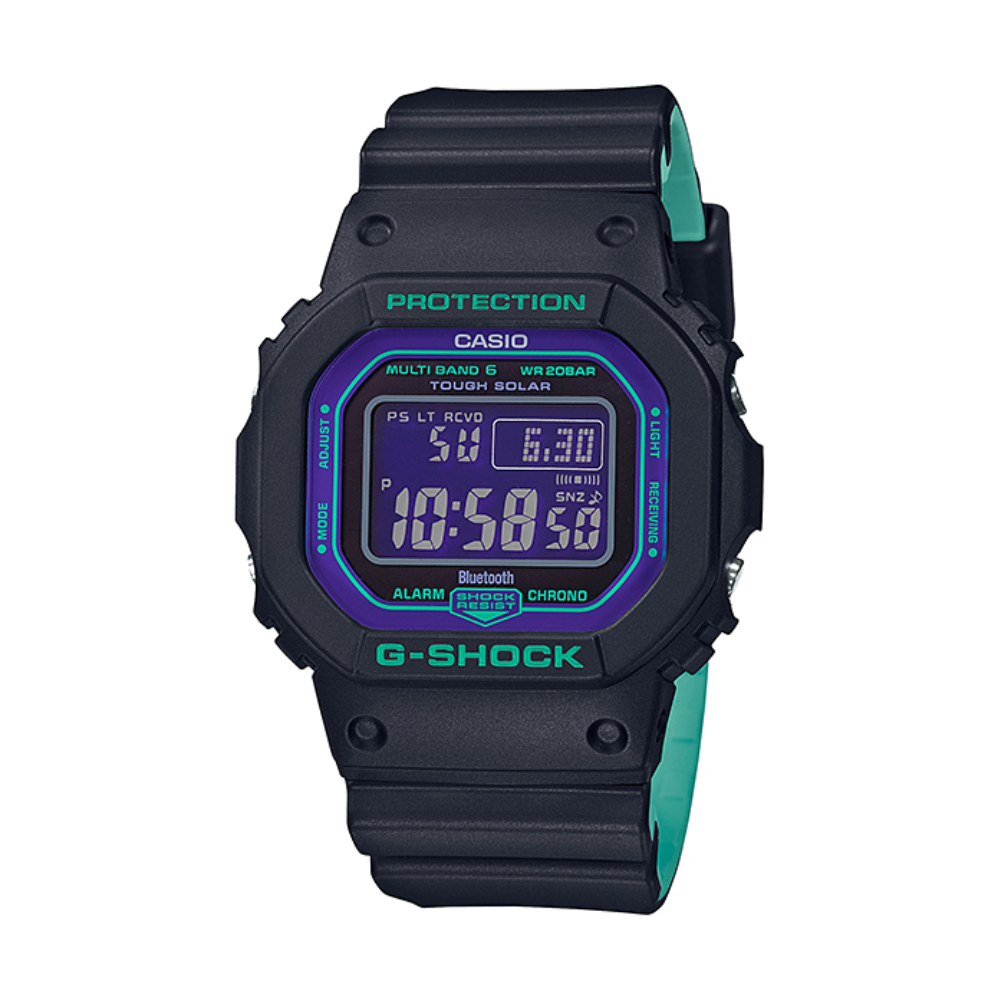 Black Casio G-Shock digital watch with green accents on a white background