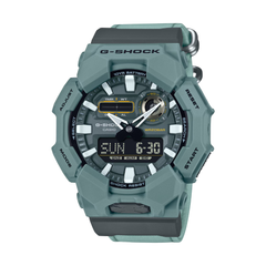 Green G-Shock watch on a white background