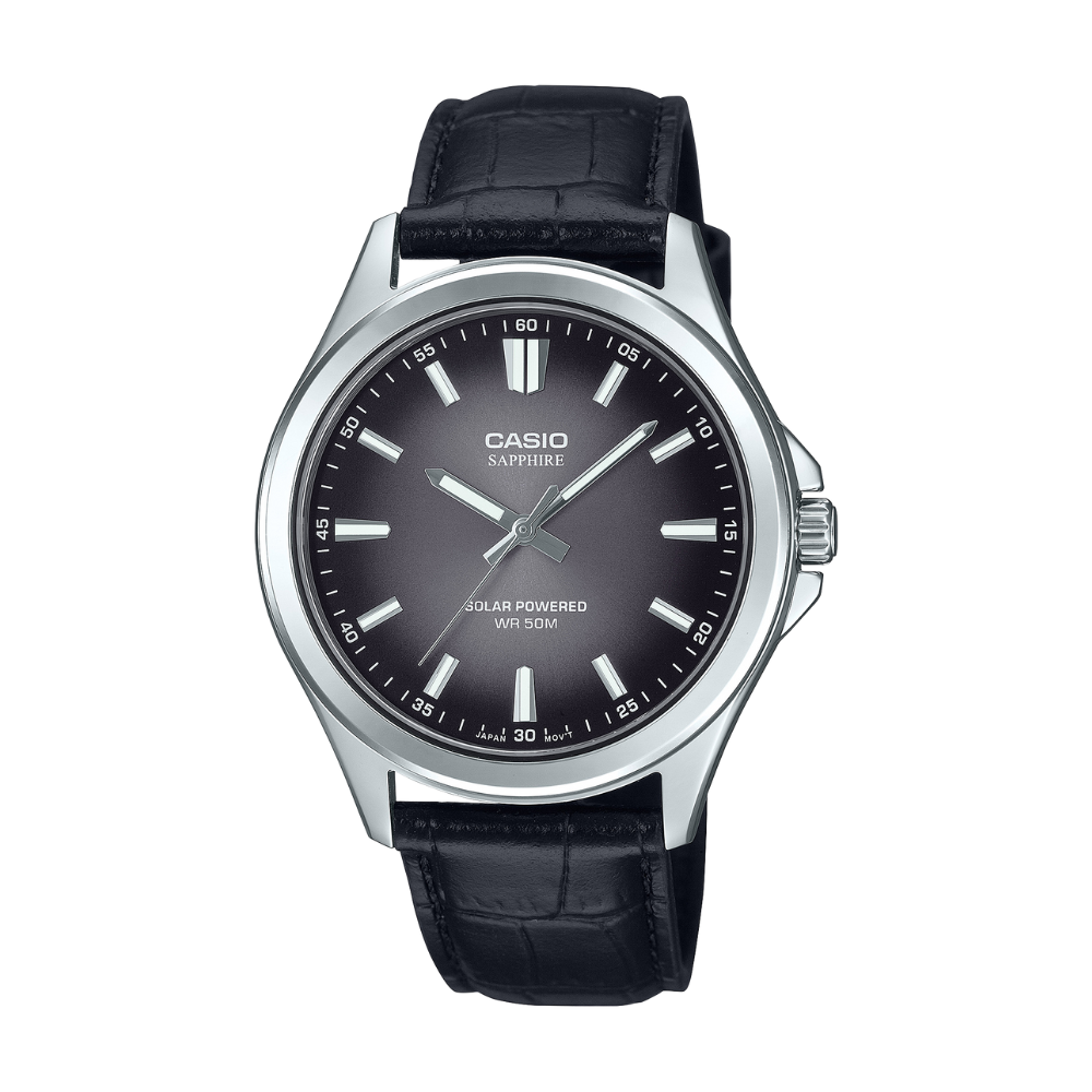 Casio watch with black leather strap and dark face on a white background